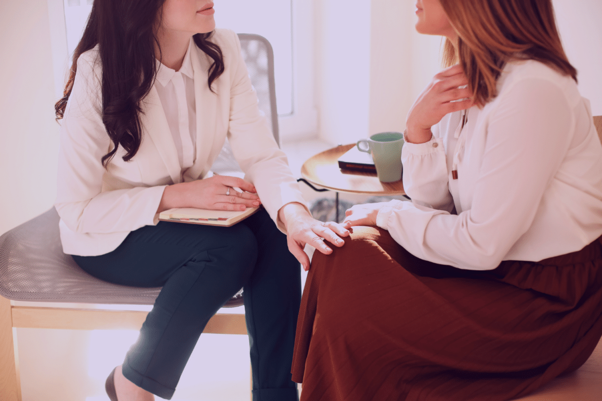 Two women speaking